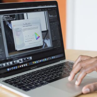 The hand on the laptop
