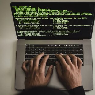 Hands on the laptop